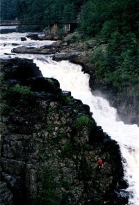 Sainte-Anne Canyon -- shot of the falls and mountain climber for scale.